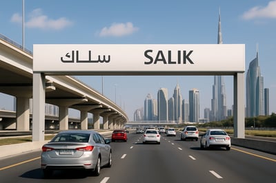 Dubai toll road with Salik gate and cars passing through